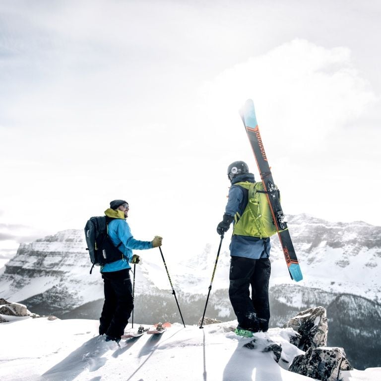 Two skiers on a mountain ridge